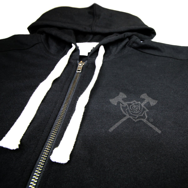 Detail of black on black Axe and Rose design on the left front chest of the hoodie with white strings.