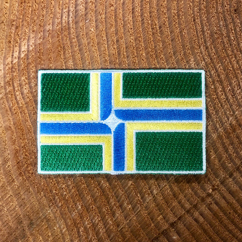 Embroidered Portland flag in full color, featuring green, gold, blue and white.